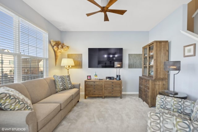 living room featuring light carpet and ceiling fan