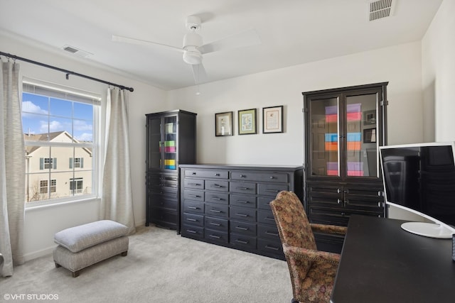 office area with light carpet and ceiling fan