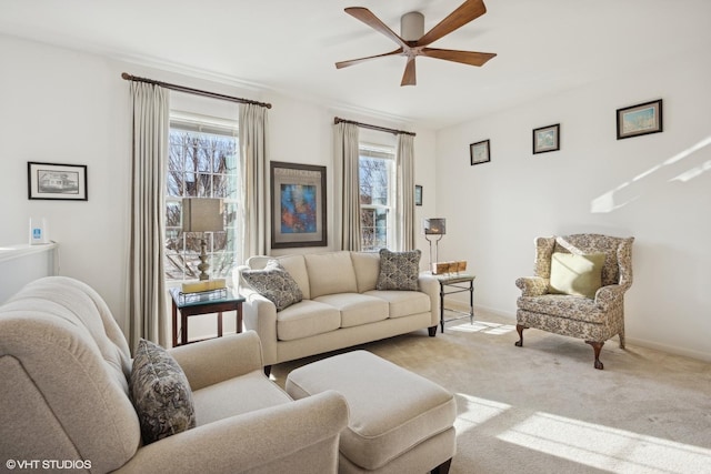 living room with light colored carpet and ceiling fan