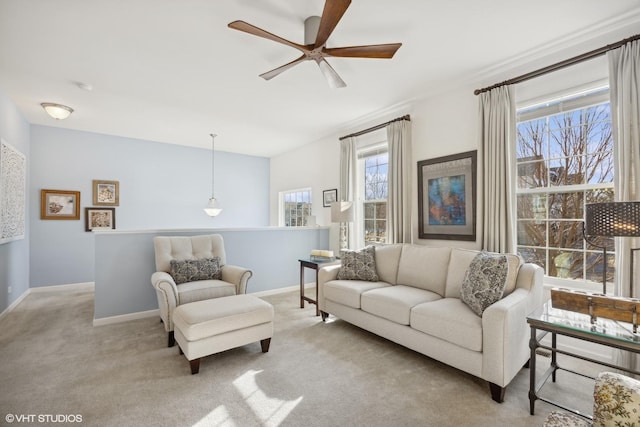 living room with light carpet and ceiling fan