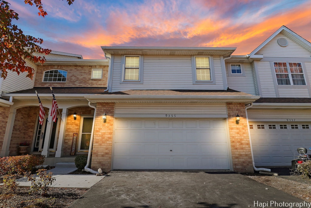 townhome / multi-family property with a garage