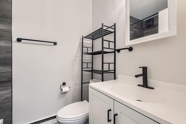 bathroom with vanity and toilet