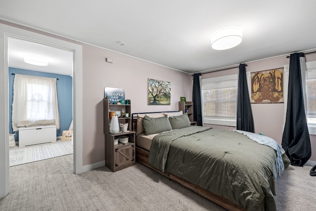 bedroom featuring light carpet