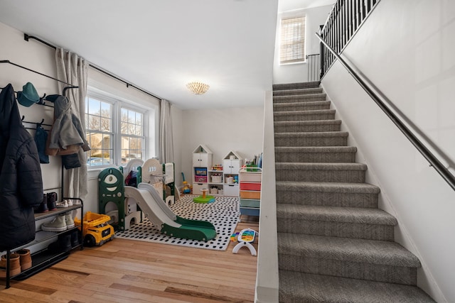 stairway featuring hardwood / wood-style floors