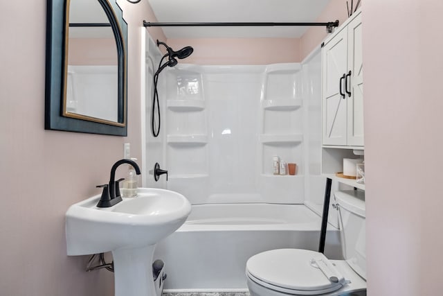 full bathroom featuring sink, bathing tub / shower combination, and toilet