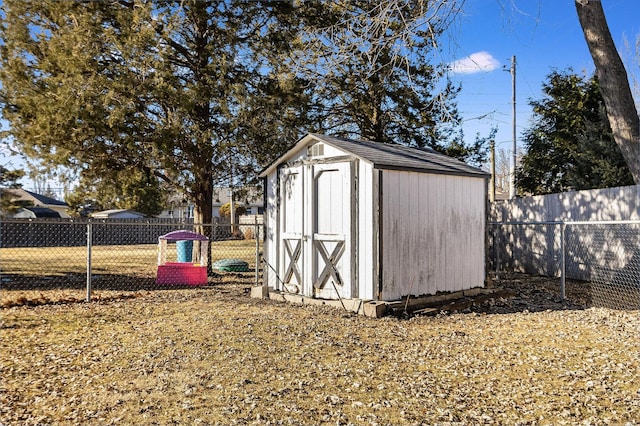 view of shed with a fenced backyard