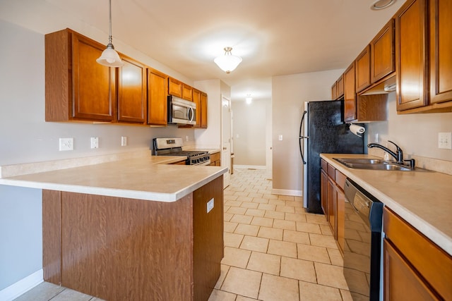 kitchen featuring sink, hanging light fixtures, light tile patterned floors, appliances with stainless steel finishes, and kitchen peninsula