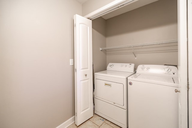 washroom featuring washer and dryer and light tile patterned floors