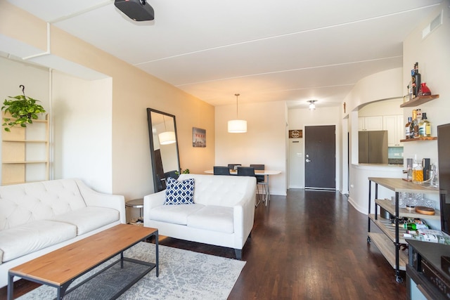 living room featuring dark wood-type flooring