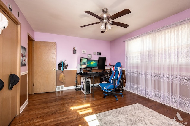 office with dark hardwood / wood-style floors and ceiling fan