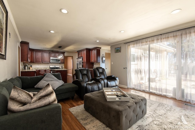 living room featuring ornamental molding and dark wood-type flooring