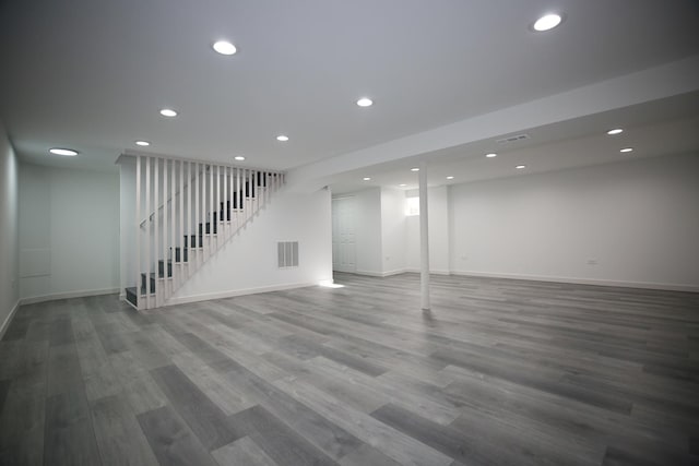 basement featuring hardwood / wood-style floors