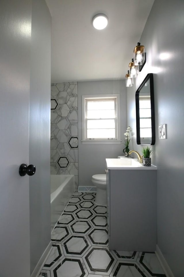 full bathroom with vanity, shower / bathing tub combination, and toilet