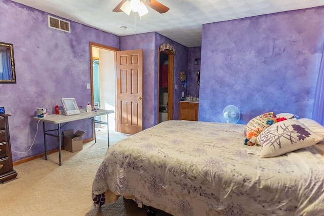 bedroom featuring light colored carpet and ceiling fan