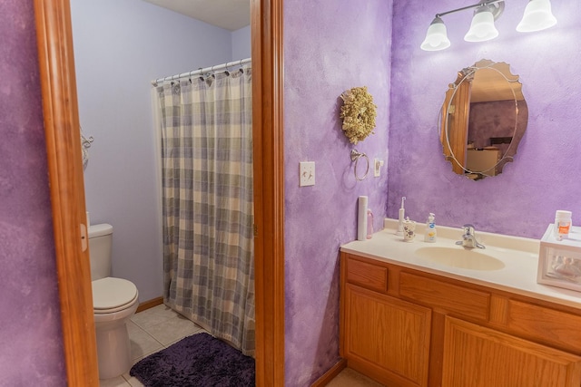 bathroom with walk in shower, vanity, tile patterned floors, and toilet