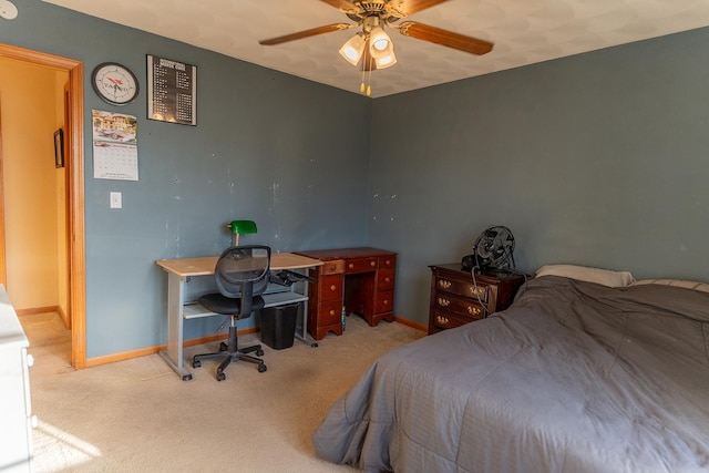 bedroom with ceiling fan and light colored carpet