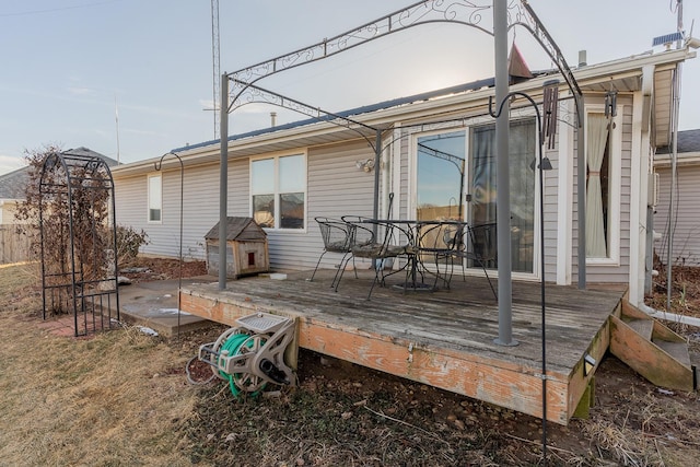 back of house featuring a deck