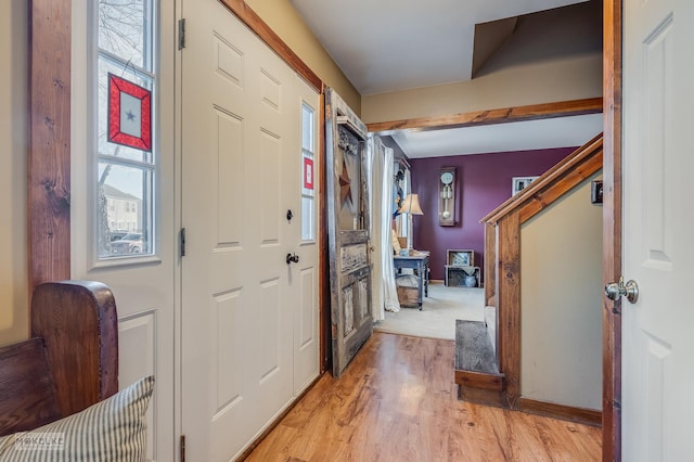 foyer with light hardwood / wood-style floors