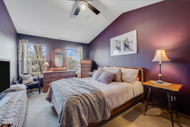 bedroom featuring ceiling fan, light colored carpet, and lofted ceiling