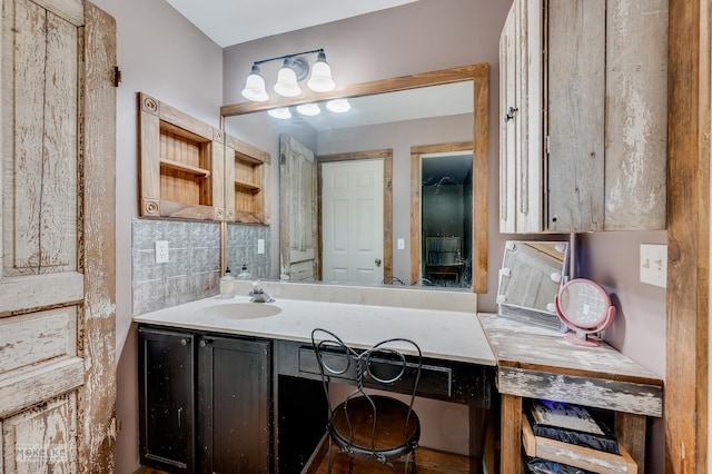 bathroom with vanity and decorative backsplash