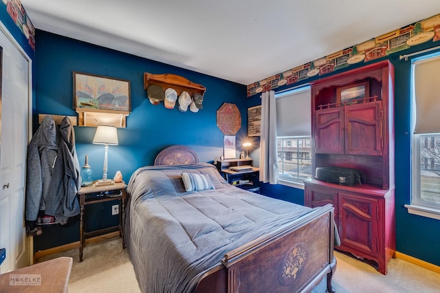 bedroom featuring light colored carpet