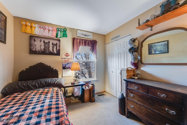 carpeted bedroom with a closet