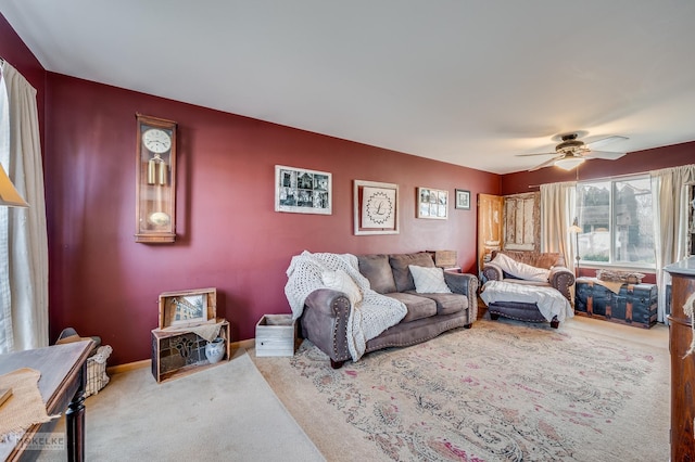 carpeted living room with ceiling fan