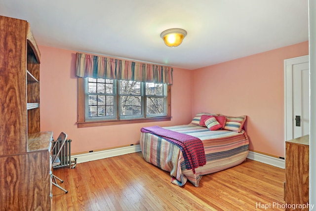 bedroom with hardwood / wood-style floors