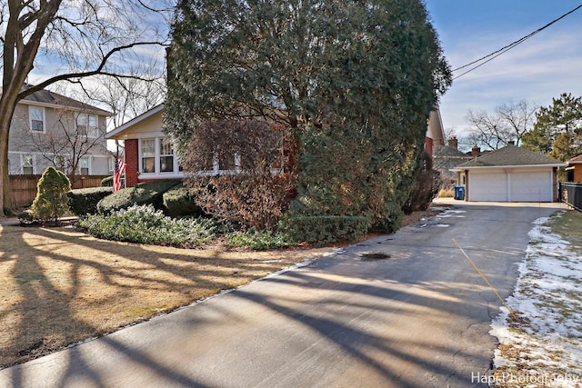 view of front of property featuring an outbuilding and a garage