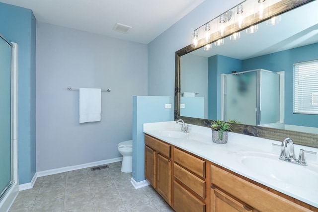 bathroom with an enclosed shower, vanity, tile patterned flooring, and toilet