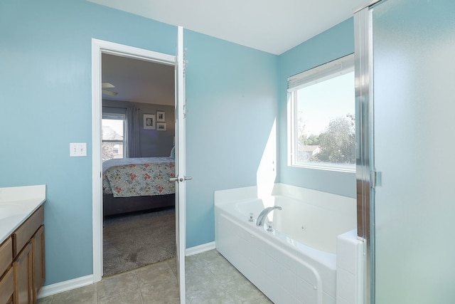 bathroom featuring tile patterned floors, vanity, and a bathtub