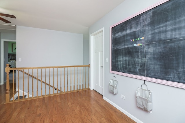 hallway featuring hardwood / wood-style flooring