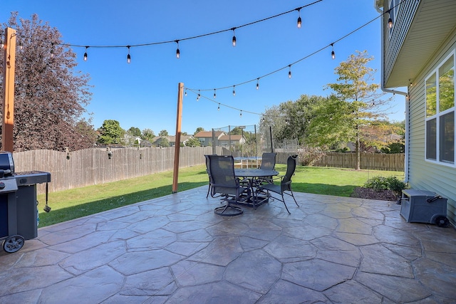 view of patio / terrace with a trampoline and area for grilling