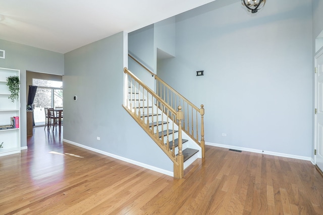 stairway featuring hardwood / wood-style flooring