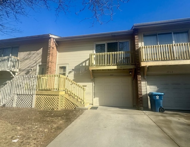 exterior space featuring a balcony and a garage