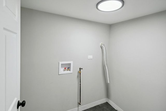 laundry room with baseboards, laundry area, and hookup for a washing machine