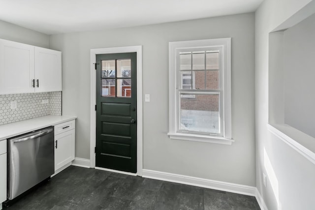 kitchen with white cabinetry, dark hardwood / wood-style flooring, dishwasher, and tasteful backsplash