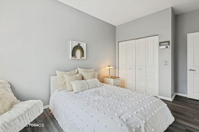 bedroom featuring dark hardwood / wood-style floors and a closet