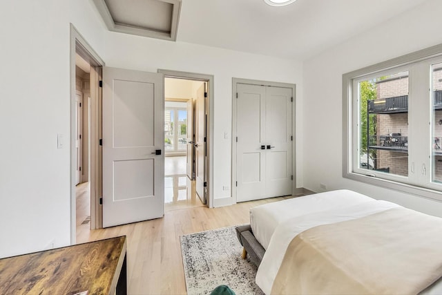 bedroom featuring light hardwood / wood-style floors and a closet