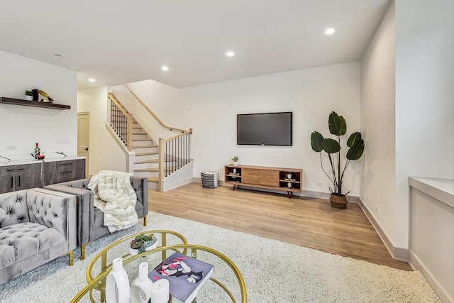 living room with light hardwood / wood-style flooring