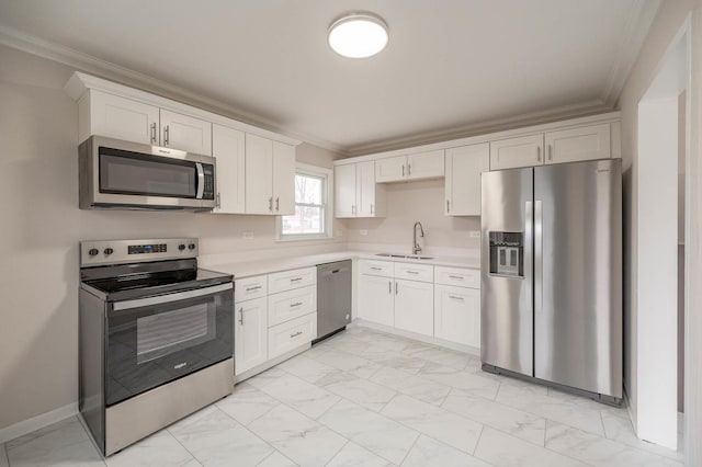 kitchen with white cabinetry, appliances with stainless steel finishes, ornamental molding, and sink