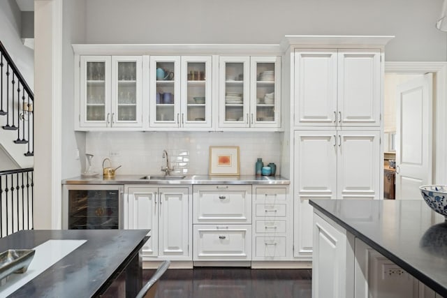 bar featuring white cabinetry, backsplash, sink, and wine cooler