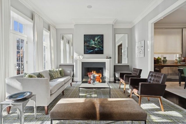 living room featuring hardwood / wood-style floors and ornamental molding