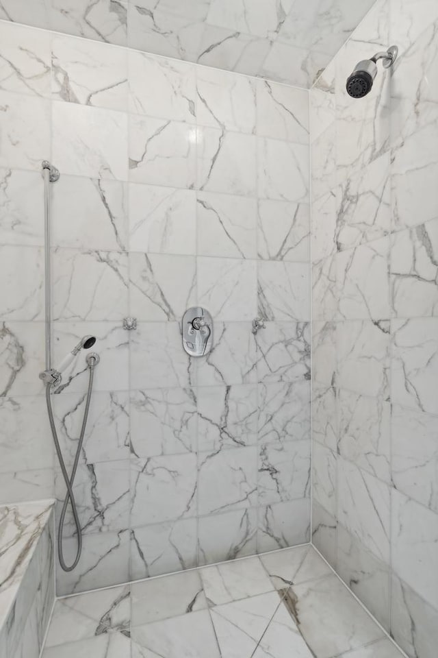 bathroom with tiled shower