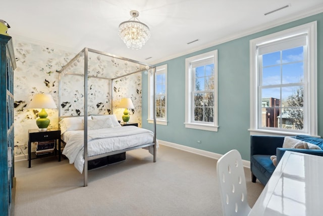 carpeted bedroom featuring multiple windows, ornamental molding, and a chandelier