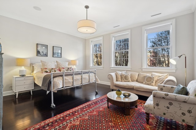 bedroom featuring crown molding and wood-type flooring