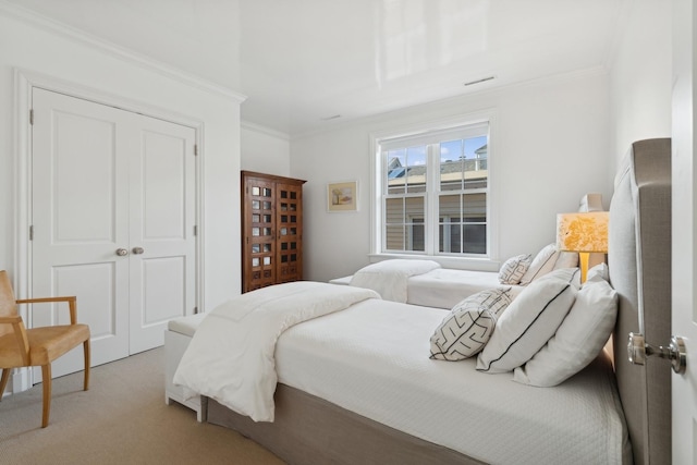 bedroom featuring light colored carpet and ornamental molding