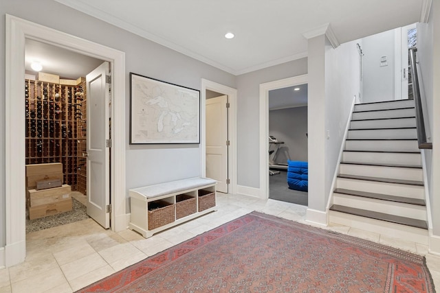 interior space featuring crown molding and light tile patterned flooring