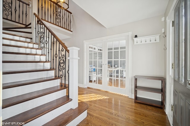 entryway featuring french doors and hardwood / wood-style flooring