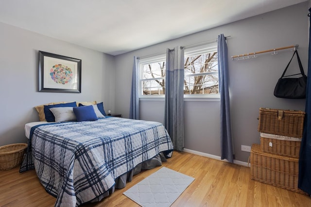 bedroom with light hardwood / wood-style floors